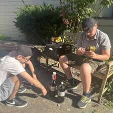 Two male Abbotsford middle school students working outside on a summer school project.